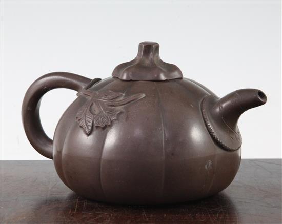 A Chinese Yixing melon-shaped teapot and cover, 19th / 20th century, length 18cm